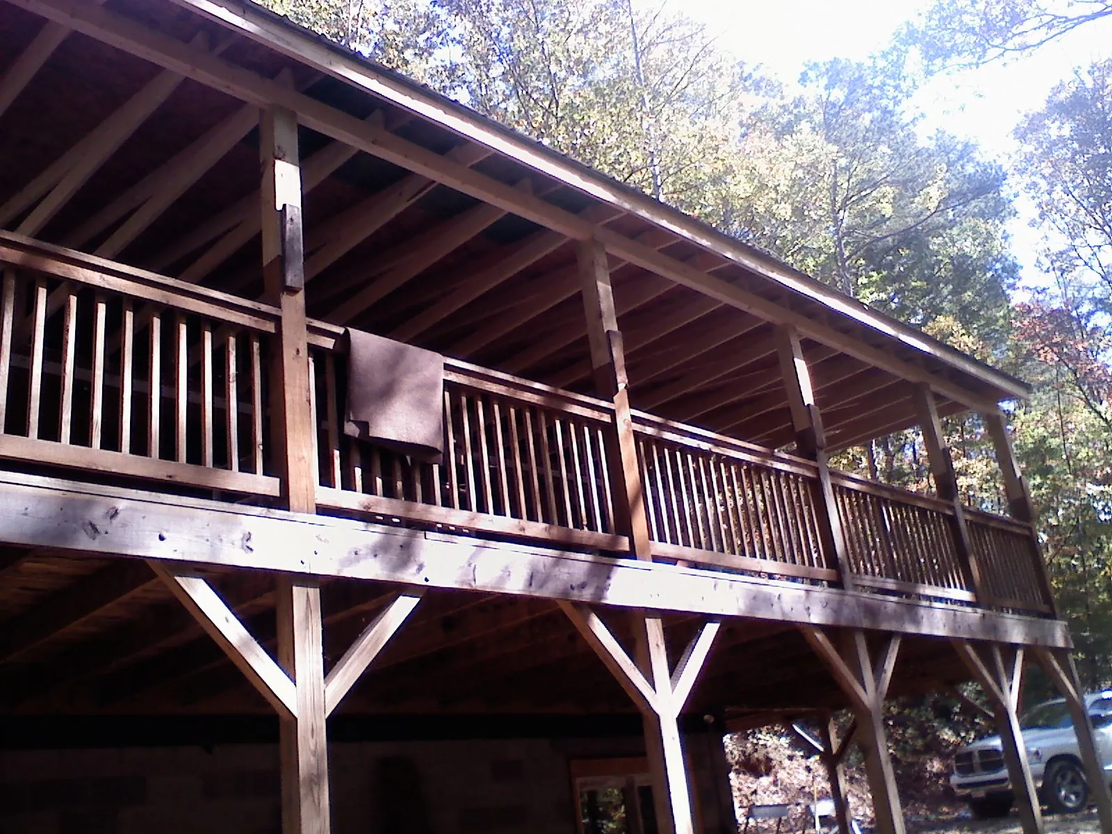 Timber framing under a new elevated porch and deck — Roof Leak Repair in Conroe by Roofing Brothers